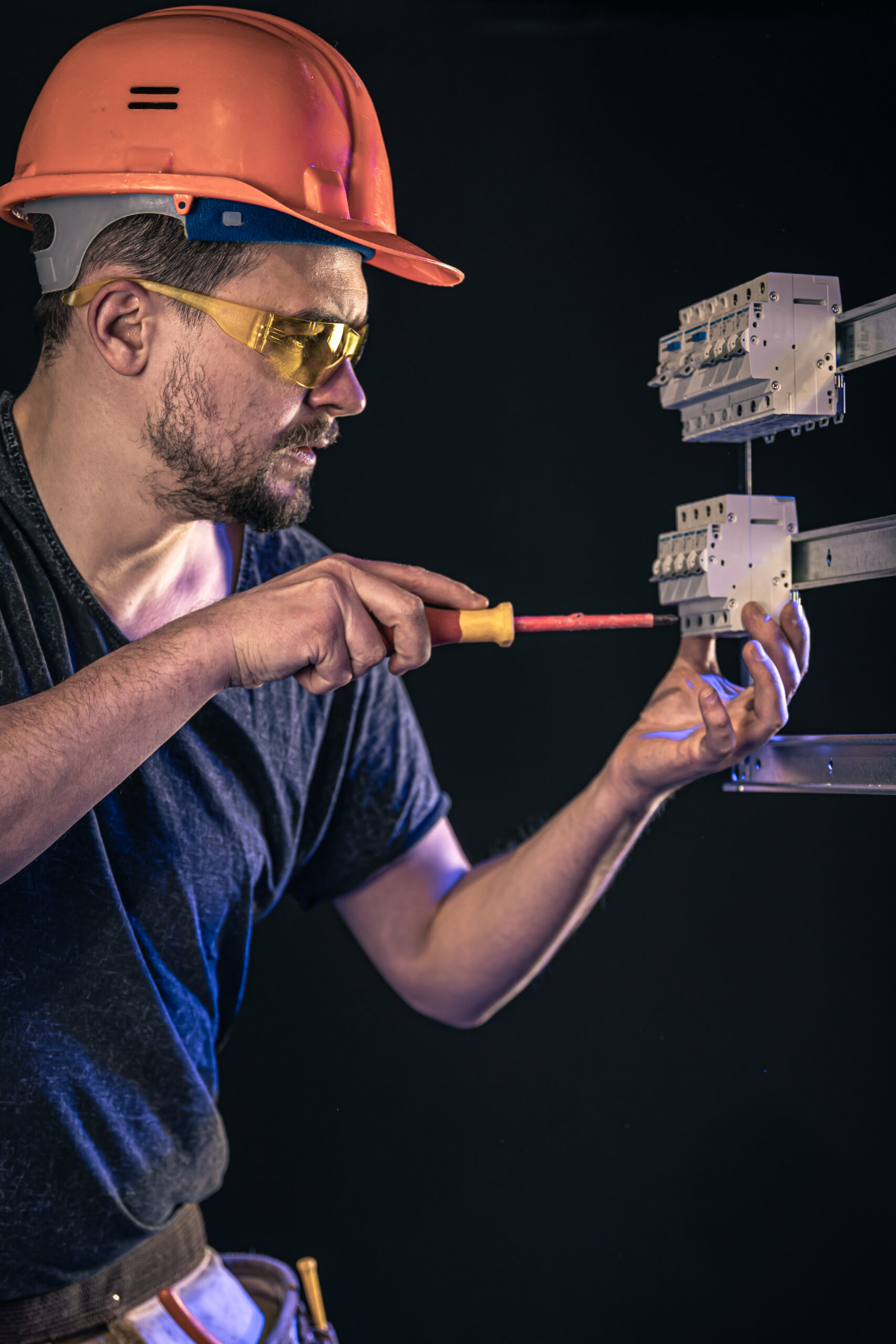 a-male-electrician-works-in-a-switchboard-with-an-electrical-connecting-cable-2